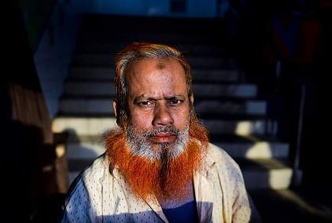 In this photo taken on December 24, 2018, street vendor and henna enthusiast Amir Hossain with a henna-dyed beard and hair poses for a photo in Dhaka. (Photo | AP)