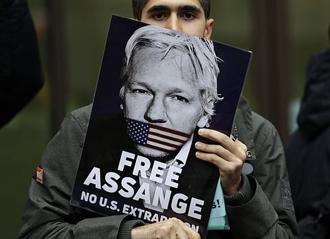 Supporters of Wikileaks founder Julian Assange demonstrate outside Westminster Magistrates' Court in London where Assange is expected to appear as he fights extradition to the United States on charges of conspiring to hack into a Pentagon computer, in Lon