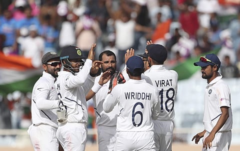 Mohammad Shami celebrates a wicket with Team India teammates. (Photo | AP)