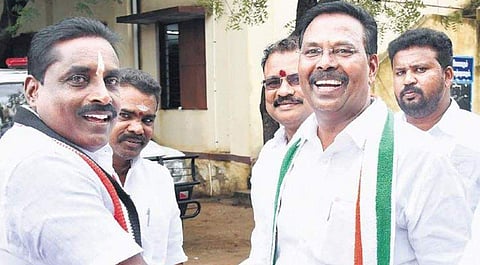AIADMK candidate V Narayanan & Congress candidate Ruby Manoharan greet each other at the polling booth in Reddiarpatti  | V KARTHIKALAGU