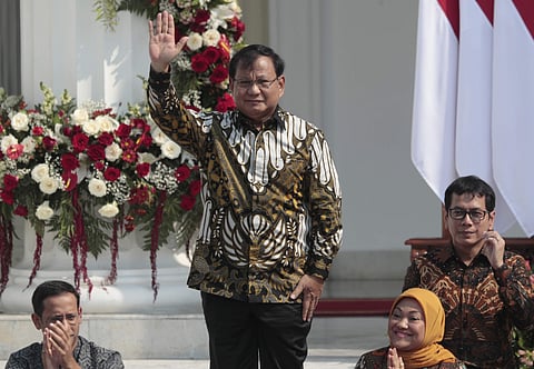 Newly appointed Defense Minister Prabowo Subianto who is the former rival of Indonesian President Joko Widodo in last April's election, waves as he is introduced during the announcement of the new cabinet at Merdeka Palace in Jakarta, Indonesia. (Photo | 