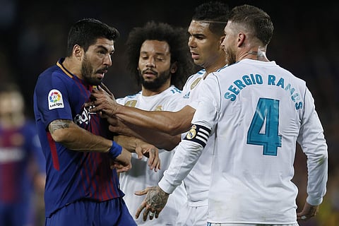 Real Madrid in an on-field altercation with Barcelona's Luis Suarez. (Photo | AP)