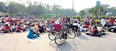 Differently abled protesters stage a sit-in on a road near Mandi House in New Delhi.| ( Photo | Arun Kumar )