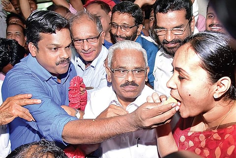 Winner of Konni assembly bypoll K U Jenish Kumar giving sweets to Veena George MLA at the CPM party office in Konni on Thursday | SHAJI VETTIPURAM