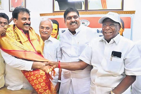 Puducherry CM V Narayanasamy congratulating A John Kumar after the by-election results for Kamaraj Nagar Assembly seat were declared on Thursday | Express