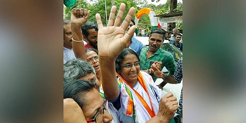 Shanimol waving hands at workers who gathered near the UDF election committee office at Pattukulangara near Thuravoor after the announcement of her victory. (Photo | Arun Angela, EPS)