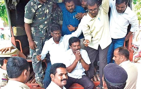Police arrest protesters who staged a road blockade in Nalgonda on Friday