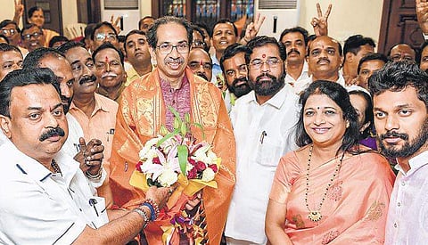 Shiv Sena chief Uddhav Thackeray in a celebratory mood with MLAs Ashish Jaiswal and Narendra Bhandekar at his Matoshree residence in Mumbai on Friday | pti