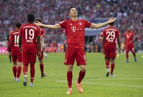 Robert Lewandowski, center, celebrates after scoring. (Photo | AP)