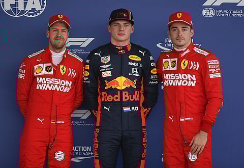 Ferrari driver Sebastian Vettel, of Germany, left, Red Bull driver Max Verstappen, of the Netherlands, center and Ferrari driver Charles Leclerc, of Monaco, pose for the photographers. (Photo | AP)