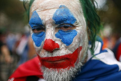 In a demonstration where over a million took to the streets of Santiago on October 25, 2019, a man is seen with his face painted to resemble the infamous ‘Joker’. According to Al Jazeera, the week-long protest which started off with students raising their
