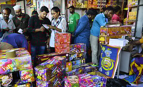 Shoppers at a firecracker stall ahead of Deepavali (Photo | D Sampath Kumar , EPS)
