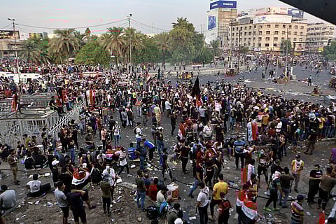 Anti-government protesters gather in Tahrir Square during a demonstration in Baghdad, Iraq, Sunday. (Photo | AP)