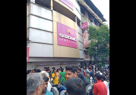 Investors gathered outside some of the closed outlets in Thane and Palghar to seek refund of their investments. (Photo | Twitter)