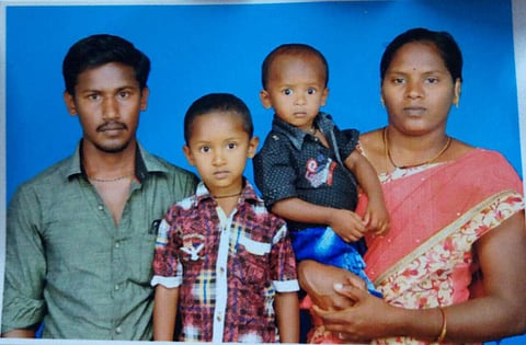Sujith Wilson, seen holding his mother's hand, with his elder brother and father.