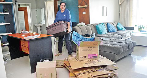 Apartment owner Saleena Mustafa packing her clothes and other items into boxes and suitcases at  the H20 Holy Faith Apartments in Maradu, which is slated for demolition  A Sanesh