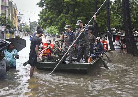 Army personals rescue NCC cadets stuck in the water logged camp after heavy rainfall in Patna. (Photo |PTI)
