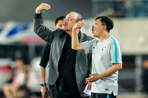 Dalian Yifang's new head coach Rafael Benitez (L) gestures during the Chinese Super League (CSL) football match between Dalian Yifang and Henan Jianye in Dalian. (Photo | AFP)