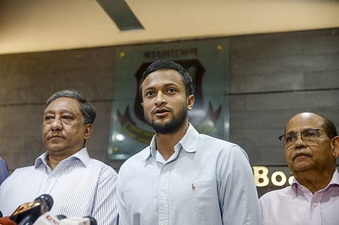 Shakib Al Hasan (C) speaks with media as Bangladesh Cricket Board (BCB) president Nazmul Hassan Papon (L) stands next to him at the Sher-e-Bangla National Stadium in Dhaka. (Photo | AFP)