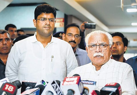 Haryana Chief Minister Manohar Lal Khattar addresses the media after a meeting, as Deputy Chief Minister Dushyant Chautala of the JJP looks on, at Haryana Bhawan in New Delhi on Tuesday (Photo| PTI)
