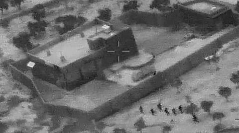 This still image from video released by the US Department of Defense on October 30, 2019, shows US forces (lower R) advancing on the compound of ISIS leader Abu Bakr al-Baghdadi in Syria on October 26, 2019. (Photo | AFP/US DEPARTMENT OF DEFENSE)