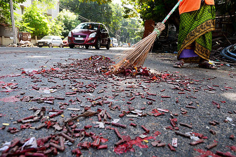 A worker cleaning the streets at Mogappair East in Chennai. (Photo | Debadatta Mallick, EPS)