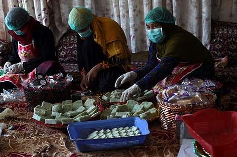 In this photo taken on October 8, 2019, Afghan female workers arrange bars of soap at an organic skin care company in Kabul. (Photo | AFP)