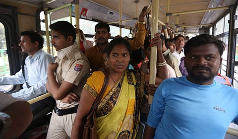 A marshal stands in a DTC bus in New Delhi. (Photo | Arun Kumar)