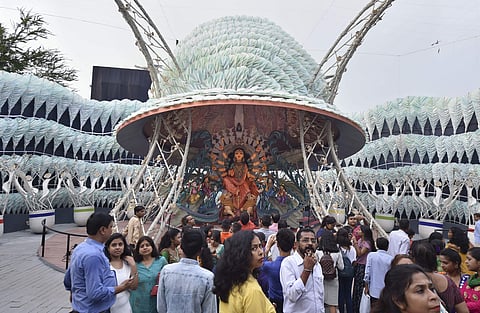 Devotees visit a community Durga puja pandal themed on the condition of refugees in the view of the panic over National Register of Citizens NRC in Kolkata. (Photo | PTI)