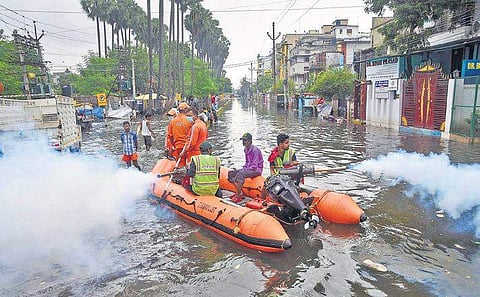 Patna Municipal Corporation (PMC) workers fumigate a flood-affected area as a precautionary measure against water-borne diseases on Thursday  | pti