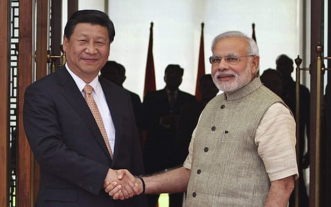 Prime Minister Narendra Modi, right, shakes hand with Chinese President Xi Jinping  (File | AP)