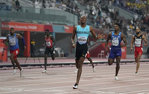 Steven Gardiner of Bahamas, center, reacts after winning the gold medal in the the men's 400 meter final. (Photo | AP)