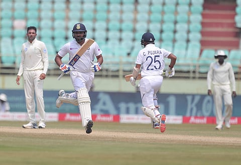 India's Rohit Sharma, left, and Cheteshwar Pujara run between the wickets during the fourth day of the first cricket test match against South Africa. (Photo | AP)