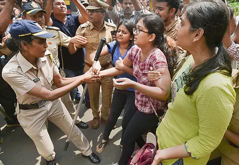 Police detain activists who were staging a protest against the tree-cutting being carried out for the Metro car shed project at Aarey colony in Mumbai Saturday Oct. 5 2019. | (Photo | PTI)