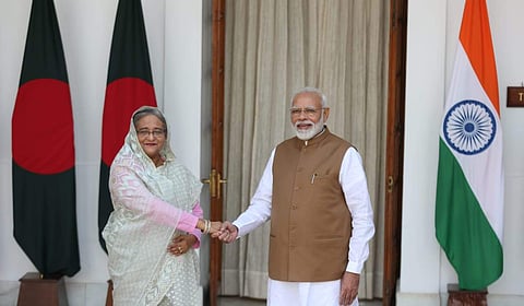Prime minister Narendra Modi shakes hand with Bangladesh Prime Minister Sheikh Hasina before their meeting in New Delhi on Saturday. | (Shekhar Yadav | EPS)