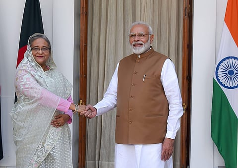 Prime Minister Narendra Modi shakes hands with his Bangladeshi counterpart Sheikh Hasina prior to a meeting at Hyderabad House in New Delhi (Photo | PTI)