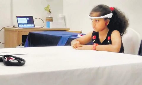 A girl wearing a SenzeBand