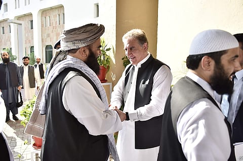 Pakistan's Foreign Minister Shah Mehmood Qureshi, center, receives members of Taliban delegation at the Foreign Office in Islamabad. (Photo| AP)
