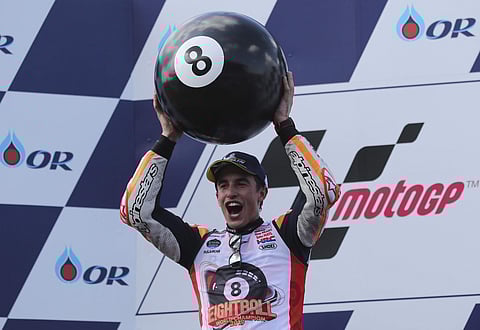 Spain's rider Marc Marquez, of the Repsol Honda Team, celebrates with an 8 ball after winning Thailand's MotoGP and his 8th Moto GP Championship. (Photo | AP)