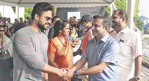 Actor Tovino Thomas and LDF Ernakulam bypoll candidate Manu Roy share pleasantries during the event | A Sanesh