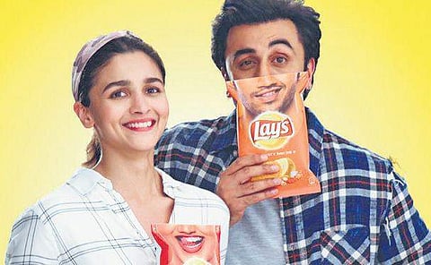 Alia Bhatt (L) and Ranbir Kapoor in a Lays commercial