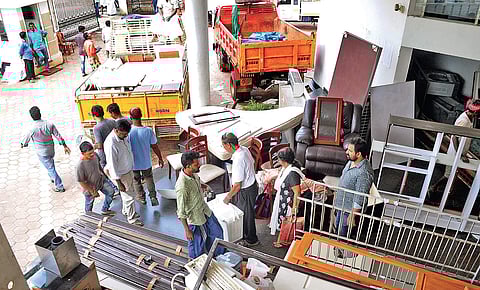 Residents of Holy Faith H2O remove household items on Saturday as Maradu municipality has allowed the flat owners to shift their belongings till October 11.| (A Sanesh | EPS)