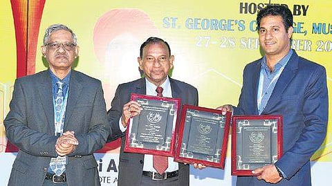 Gerry Arathoon (middle), chief executive officer  &secretary, CISCE, awarded ‘Best Principal’ certificate to Brother Tony Verghese (Right), principal, St George’s College. (Photo | EPS)