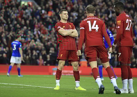 Liverpool's James Milner celebrates his wining goal with Liverpool's Jordan Henderson and Liverpool's Divock Origi. (Photo | AP)