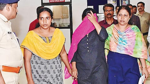 Jollyamma Joseph being brought out of the District Crime Branch office in Vadakara to be produced before the Thamarassery court. | ( Photo | EPS )