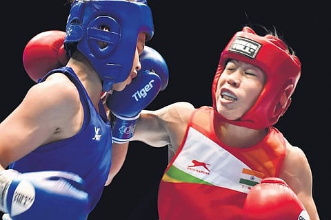 India’s MC Mary Kom (right) in action against Thailand’s Jutamas Jitpong during their 51kg category contest on Tuesday. (File Photo)