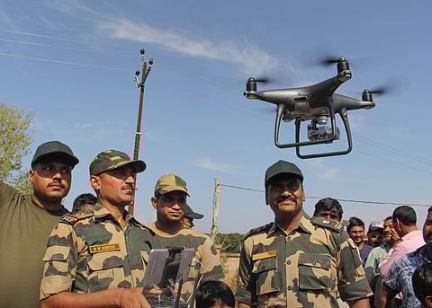 BSF officials explain the working of drone to the border area villagers at Gole Pattan village in Kanachak sector of Indo-Pak border about 25 kms from Jammu Saturday Oct. 5 2019. | (Photo | PTI)