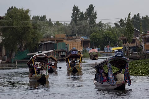 In this Saturday, Aug. 3, 2019, file photo, Tourists in Shikaras, a traditional gondola, cross the Dal Lake as they prepare to leave Srinagar. | (File | AP)