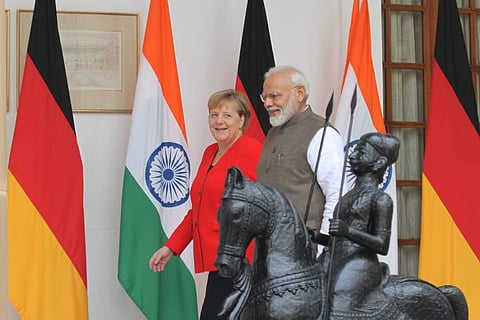 PM Narendra Modi shakes hand with German Chancellor Angela Merkel before their meeting in New Delhi on Friday. (Photos | EPS/ Shekhar Yadav)