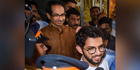 Shiv Sena chief Uddhav Thackeray with son Aaditya after the legislature party meeting on Thursday. (Photo| PTI)